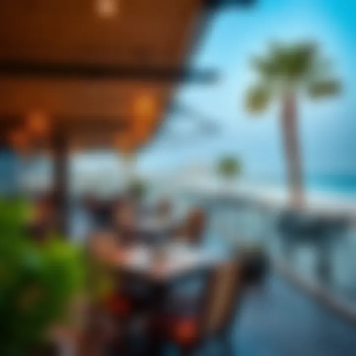 An outdoor terrace dining area with stunning views of the beach