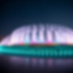 The Dubai Fountain performing at dusk with illuminated colors